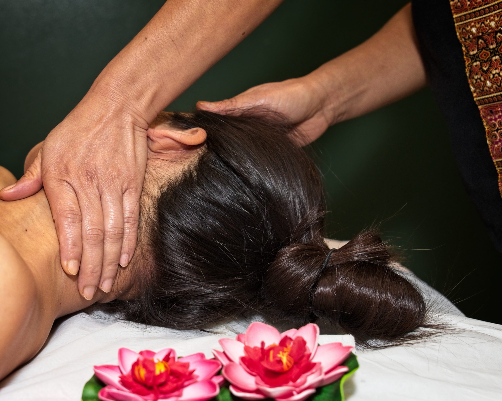 Therapist giving a head massage