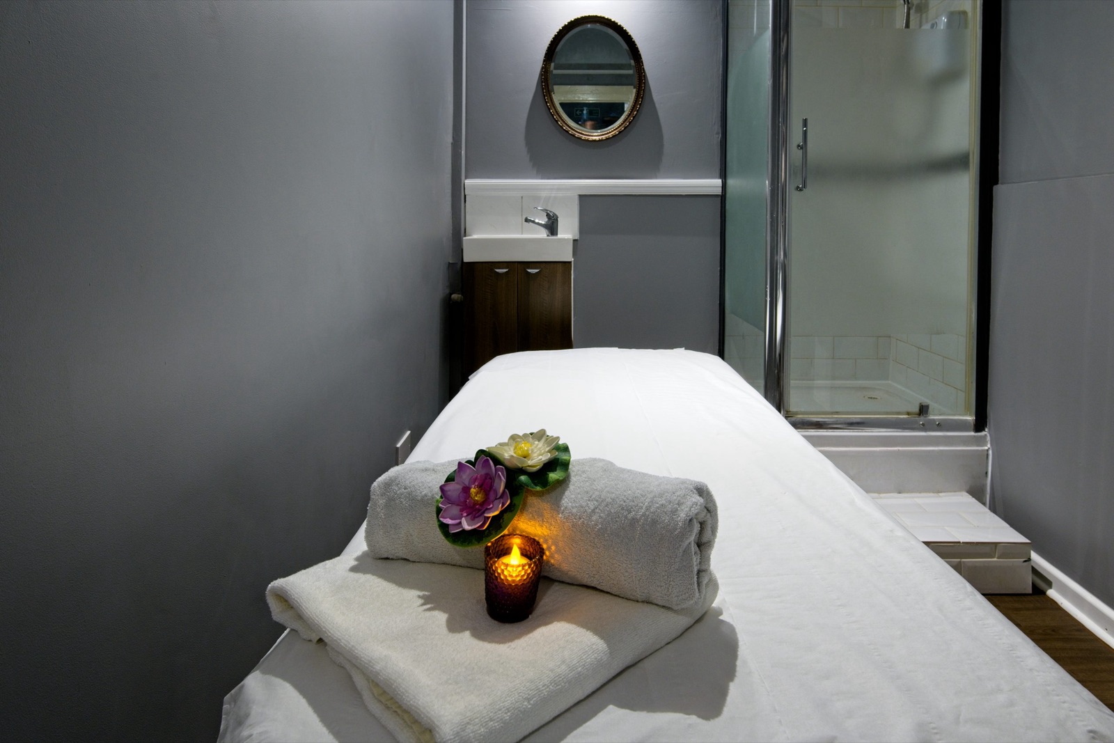 Treatment bed with flowers and candle